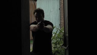 A still from Hunter, Hunter stops in a doorway.