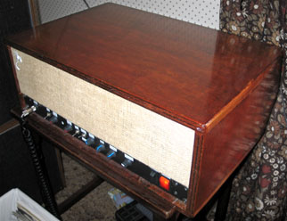 Phoenix mounted in a mahogany plywood cabinet with hessian screen material on the front over a black control panel